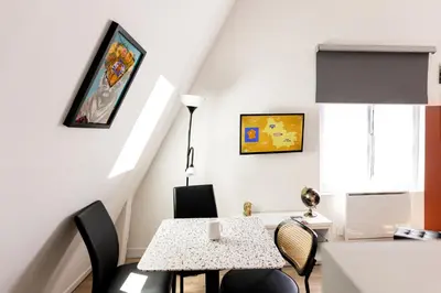 Télévision ou salle de divertissement dans l'établissement Mirabeau Sous Les Toits - Tours