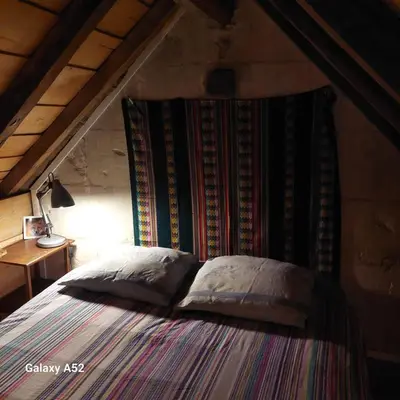 Un ou plusieurs lits dans un hébergement de l'établissement Maison rustique à la campagne