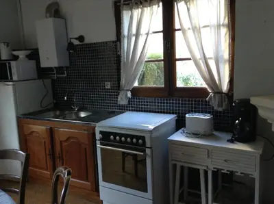 Cuisine ou kitchenette dans l'établissement La Maison d'Ambre
