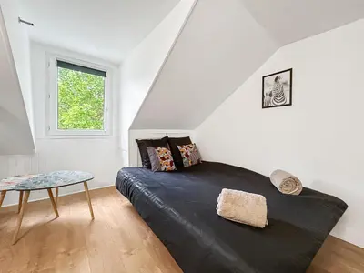 Coin salon dans l'établissement Douillet studio avec Wi-Fi, proche Transports