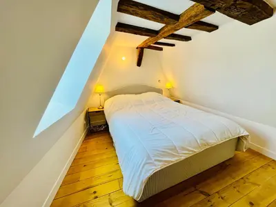 Un ou plusieurs lits dans un hébergement de l'établissement Centre-ville, cathédrale, cosy, duplex, le numéro 12
