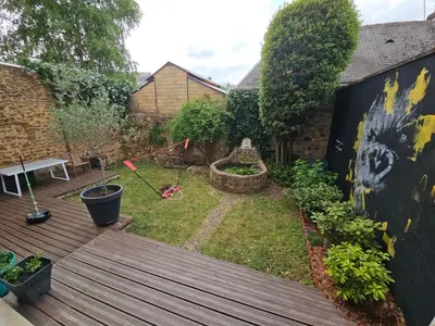 Jardin de l'établissement Chambre familiale chez l'habitant