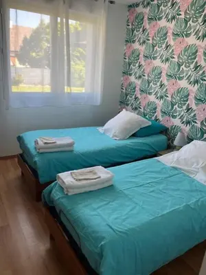 Un ou plusieurs lits dans un hébergement de l'établissement location Chambres proximite du circuit 24 h
