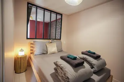 Un ou plusieurs lits dans un hébergement de l'établissement Spa sous le Mokuren - Escapade Zen à Blois