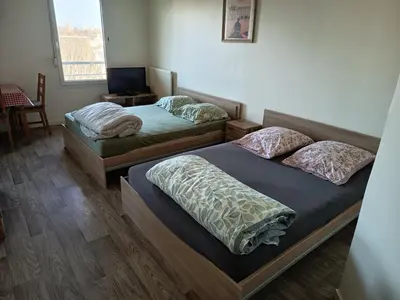 Un ou plusieurs lits dans un hébergement de l'établissement T1 TOURS NORD 38m2 - 4 couchages