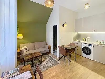 Coin salon dans l'établissement Le Trinity tout confort avec parking privé au centre ville