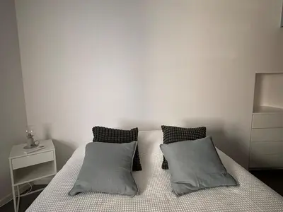 Un ou plusieurs lits dans un hébergement de l'établissement Charme Place Chateauneuf - Coeur de Tours