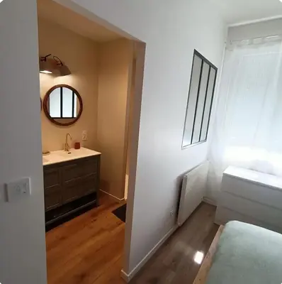 Un ou plusieurs lits dans un hébergement de l'établissement Chambre cosy avec salle de bain privative