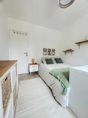 Un ou plusieurs lits dans un hébergement de l'établissement Appartement 6 chambres