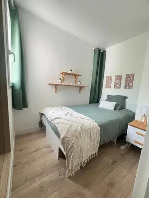 Un ou plusieurs lits dans un hébergement de l'établissement Appartement 6 chambres