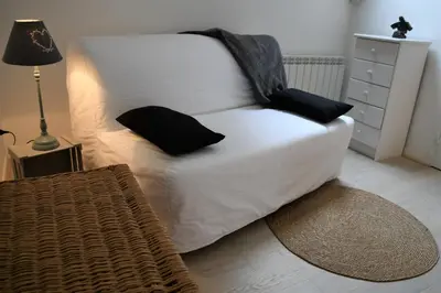 Un ou plusieurs lits dans un hébergement de l'établissement La Petite Maison d'à Côté