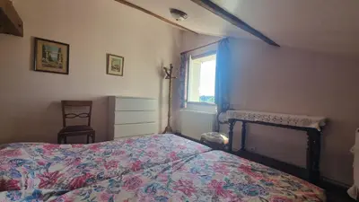 Un ou plusieurs lits dans un hébergement de l'établissement Appartement indépendant avec terrasse