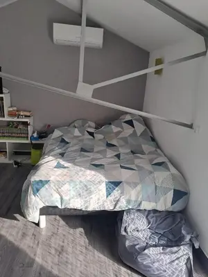 Un ou plusieurs lits dans un hébergement de l'établissement Chambres proche gare centre ville