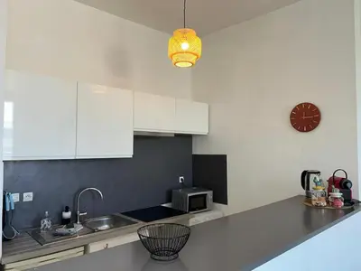 Cuisine ou kitchenette dans l'établissement L'Oasis - Halles Châtellerault