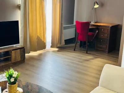 Télévision ou salle de divertissement dans l'établissement Appartement de la Gare