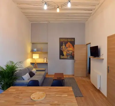 Télévision ou salle de divertissement dans l'établissement Appartement coeur de ville