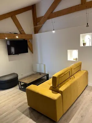 Télévision ou salle de divertissement dans l'établissement Charmante petite maison