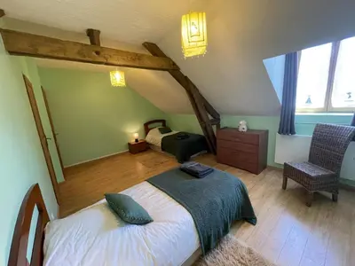 Un ou plusieurs lits dans un hébergement de l'établissement Gîtes du Château de Malcombe