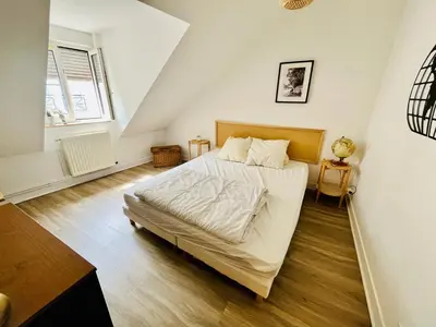 Un ou plusieurs lits dans un hébergement de l'établissement Le Duplex Franciade, centre-ville, parking, 2 chambres