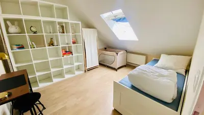 Un ou plusieurs lits dans un hébergement de l'établissement Le Duplex Franciade, centre-ville, parking, 2 chambres