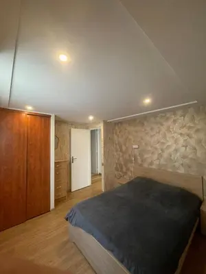 Un ou plusieurs lits dans un hébergement de l'établissement Charmante Apartment