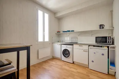 Cuisine ou kitchenette dans l'établissement Le Nid du Mans