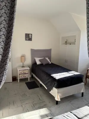 Un ou plusieurs lits dans un hébergement de l'établissement Gîte Calme & Accueillant -Près de Beauval