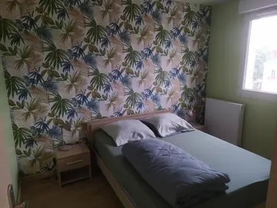 Un ou plusieurs lits dans un hébergement de l'établissement T3 COSY 2 chambres proche TOURS