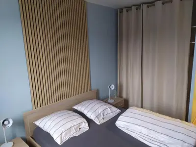 Un ou plusieurs lits dans un hébergement de l'établissement T3 COSY 2 chambres proche TOURS