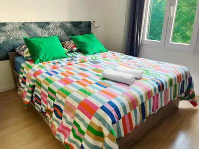 Un ou plusieurs lits dans un hébergement de l'établissement Studio Jozy I confort et jardin en ville 4pers I Futuroscope