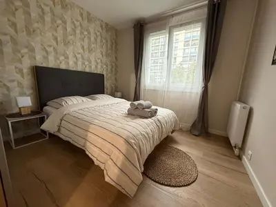 Un ou plusieurs lits dans un hébergement de l'établissement Liberte-Apartment with parking