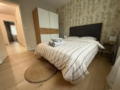 Un ou plusieurs lits dans un hébergement de l'établissement Liberte-Apartment with parking