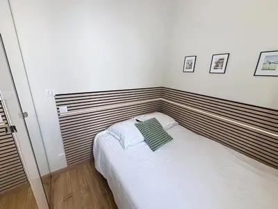 Un ou plusieurs lits dans un hébergement de l'établissement Le Dolby - 2 appartements communiquants avec parking privé 4 couchages