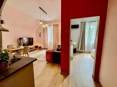 Télévision ou salle de divertissement dans l'établissement Le Dolby - 2 appartements communiquants avec parking privé 4 couchages