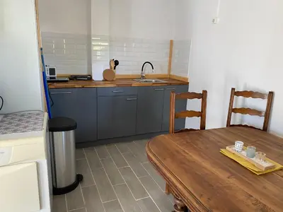 Cuisine ou kitchenette dans l'établissement La Chambrière