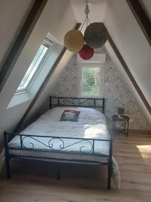 Un ou plusieurs lits dans un hébergement de l'établissement Charmant chalet