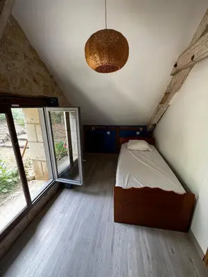Un ou plusieurs lits dans un hébergement de l'établissement Cottage en nature Le Pigeonnier de la Manse