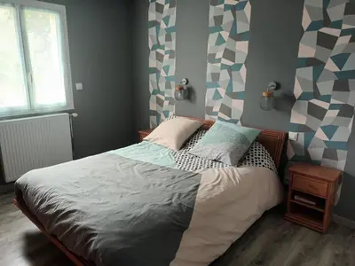 Un ou plusieurs lits dans un hébergement de l'établissement Location chambre à 5 min du circuit des 24 H du Mans