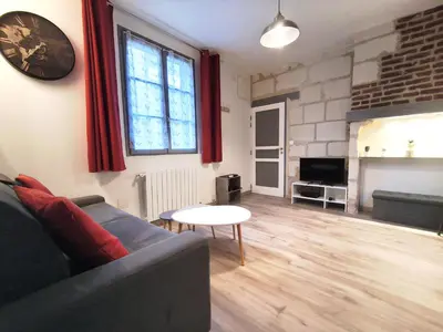 Coin salon dans l'établissement Le coeur de la ville