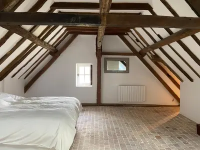 Un ou plusieurs lits dans un hébergement de l'établissement Le petit chateau