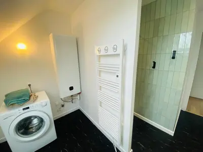 Salle de bains dans l'établissement Le Petit et Grand Francillon