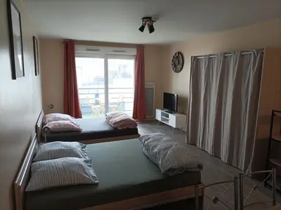 Un ou plusieurs lits dans un hébergement de l'établissement T1 cosy 4 personnes à Tours Nord