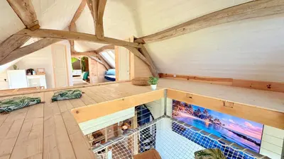 Télévision ou salle de divertissement dans l'établissement Gîte 