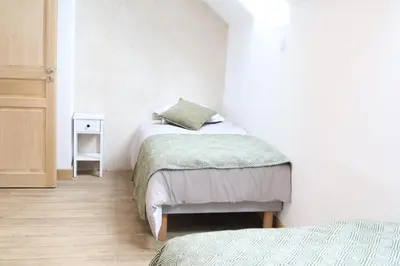 Un ou plusieurs lits dans un hébergement de l'établissement Gîte de L'Atelier