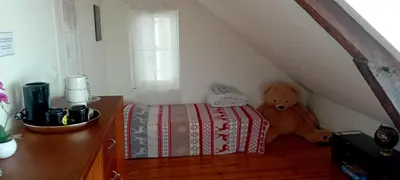 Un ou plusieurs lits dans un hébergement de l'établissement Chez ISA chambre chez l'habitant Léa