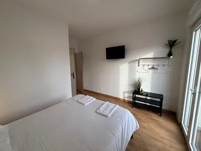 Un ou plusieurs lits dans un hébergement de l'établissement Appartement 10 personnes avec terrasse à Vallères