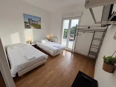Un ou plusieurs lits dans un hébergement de l'établissement Appartement 10 personnes avec terrasse à Vallères