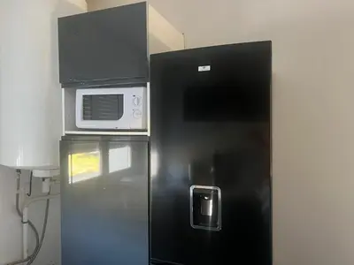 Cuisine ou kitchenette dans l'établissement Appartement sympathique