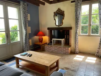 Coin salon dans l'établissement La Maison de Maître, Loire Gîte