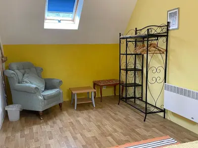 Coin salon dans l'établissement La Maison de Maître, Loire Gîte